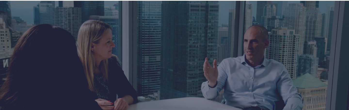 people talking at a conference table